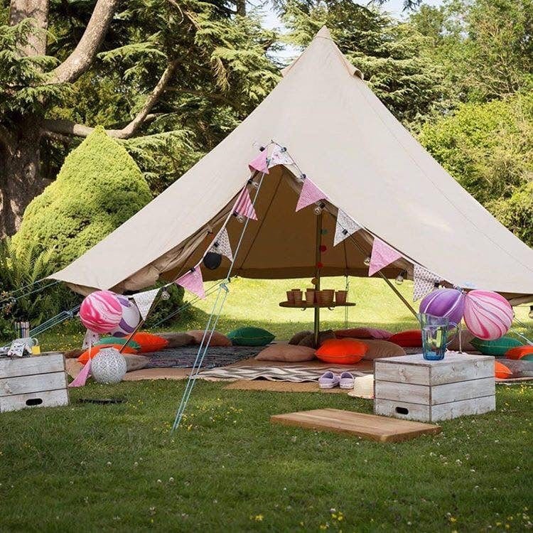 Floating canopy bell tent in garden